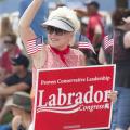 Angela Cross carries a sign supporting Representative Raul Labrador - Photo courtesy of 29k Productions