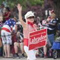 Republicans carry signs in support of conservative candidates like Raul Labrador during the CdA American Heroes Parade - Photo courtesy of 29k Productions