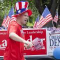 Kootenai County Republican Central Committee Treasurer Doug Balija enjoys his time walking in the parade and giving out flags - Photo courtesy of 29k Productions