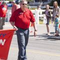 Kootenai County Clerk Jim Brannon helps carry the KCRCC banner in the Hayden Days Parade - Photography by 29k Productions