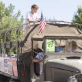 Young Kootenai County Republican riding on a WWII GMC CCKW Deuce and a Half Truck in the Hayden Days Parade - Photography by 29k Productions